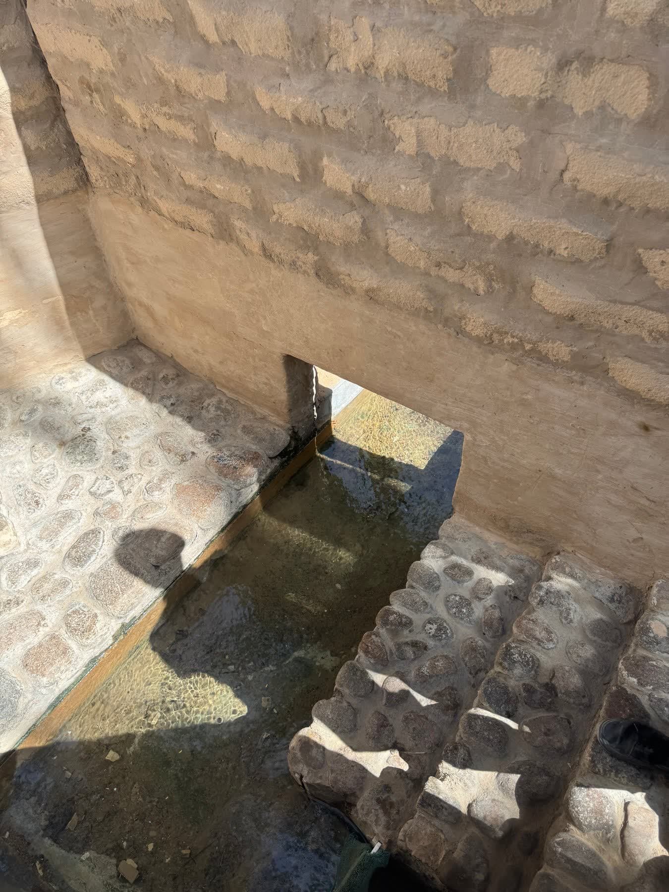 Water flowing through an irrigation channel in the oasis; photographed by Takeki Shinkawa during his visit.