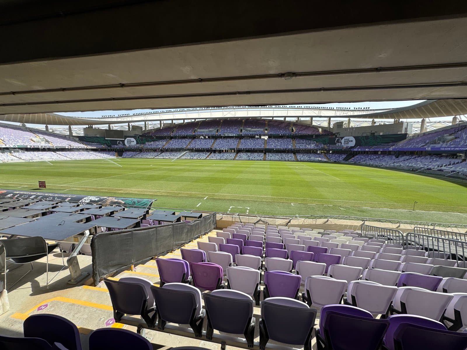 The pitch and stands at a stadium in Al Ain; photographed by Takeki Shinkawa during his visit.