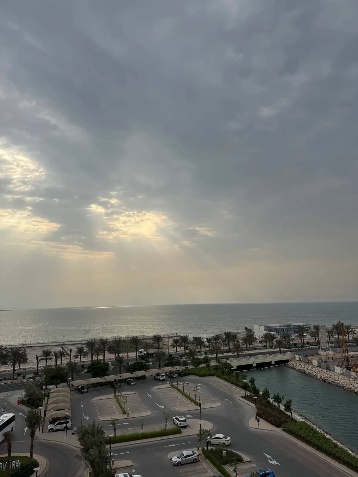 The coastal view during the Rove stay, with the sea beyond the road and waterfront.