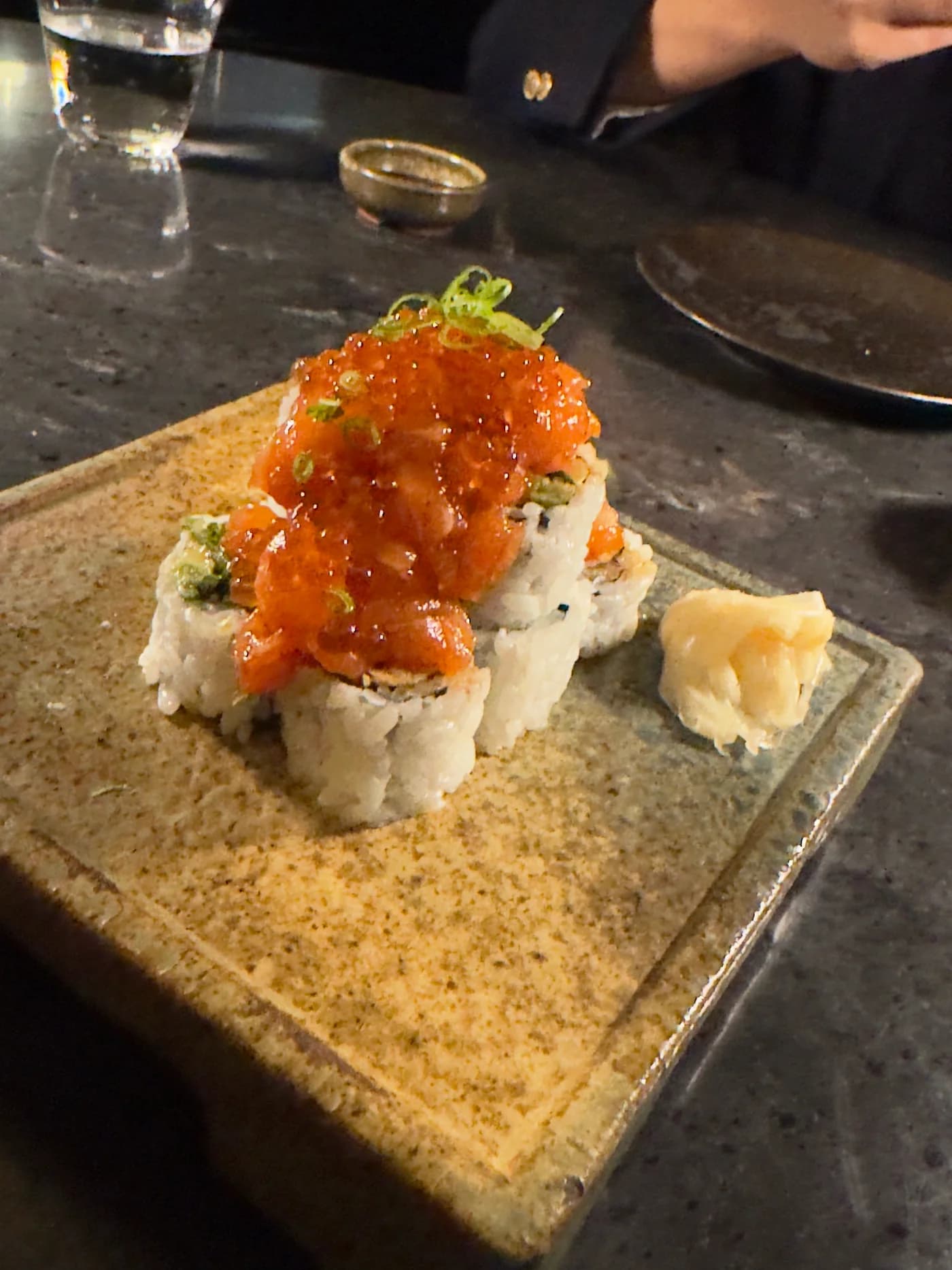 A plate of sushi rolls photographed during an evening meal at Kasumigaseki